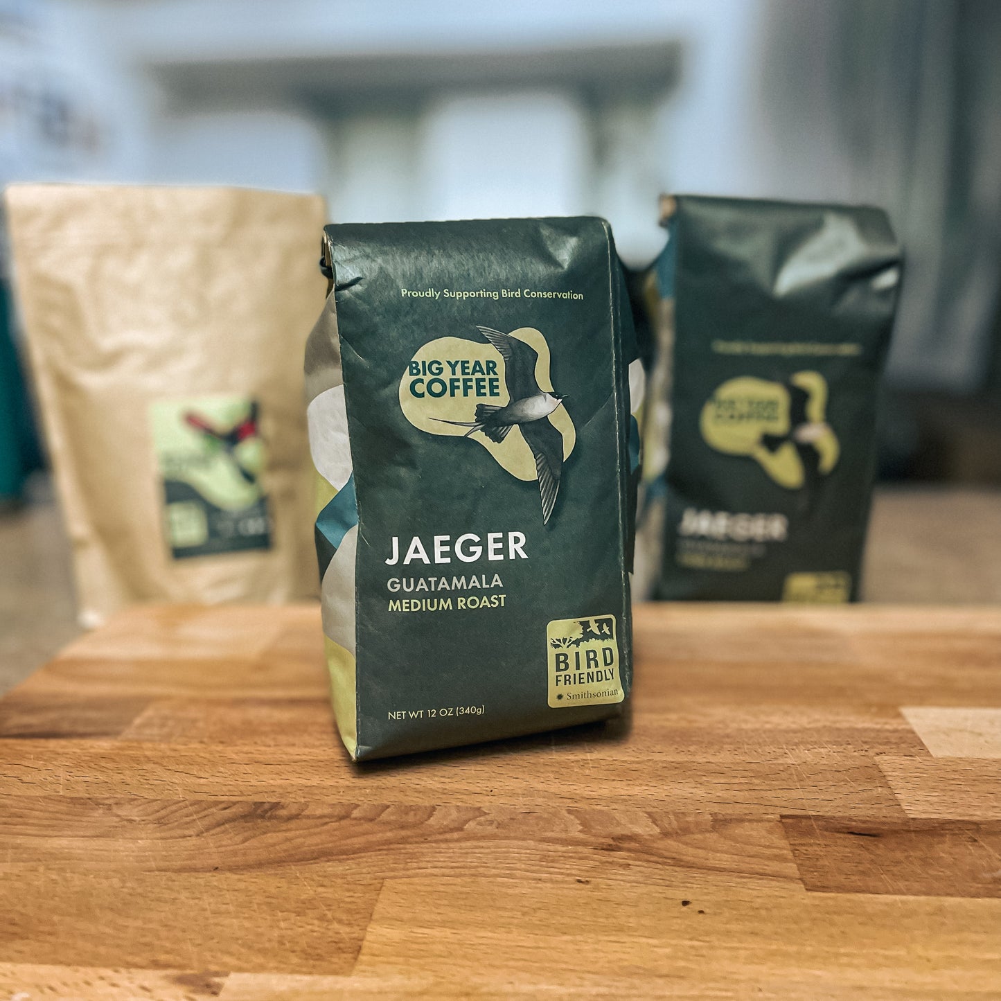A bag of Medium Roast Guatemala from Big Year Coffee rests on a cutting board displaying the front of the packaging.