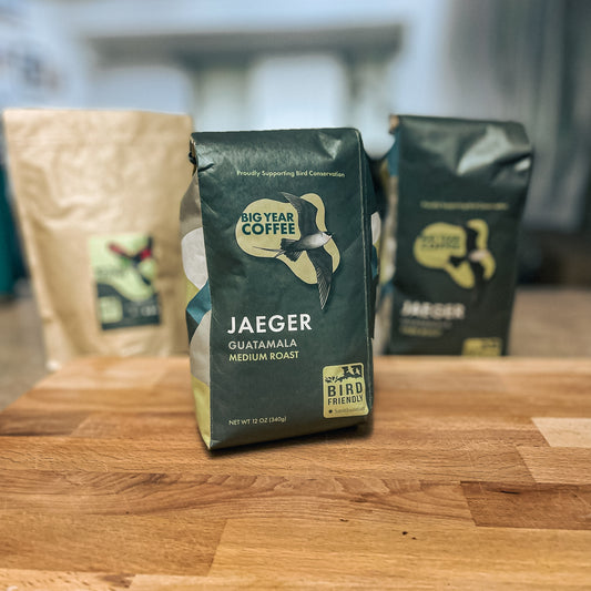 A bag of Medium Roast Guatemala from Big Year Coffee rests on a cutting board displaying the front of the packaging.